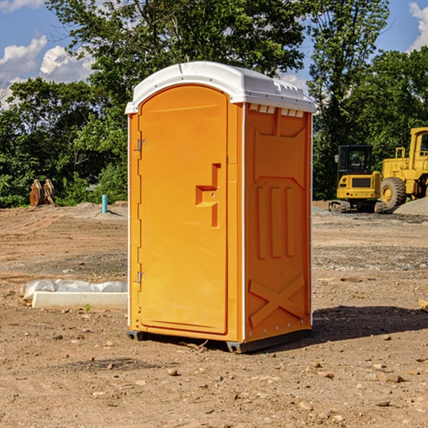 what is the cost difference between standard and deluxe portable restroom rentals in Nocona